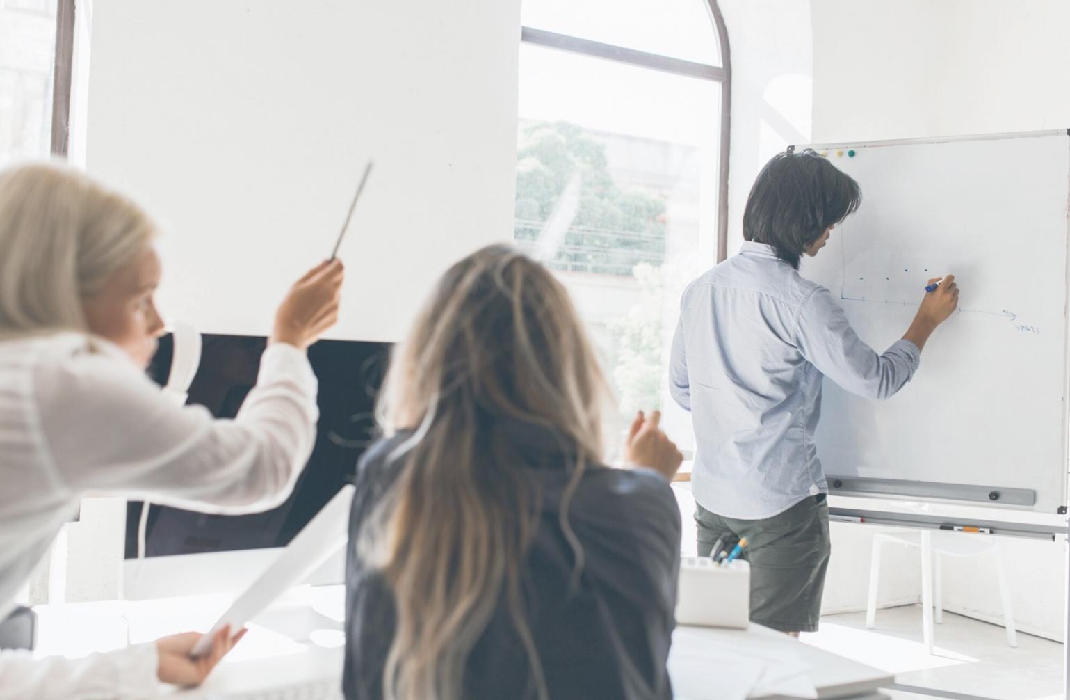 Successful business meeting with financial growth charts and positive team discussion